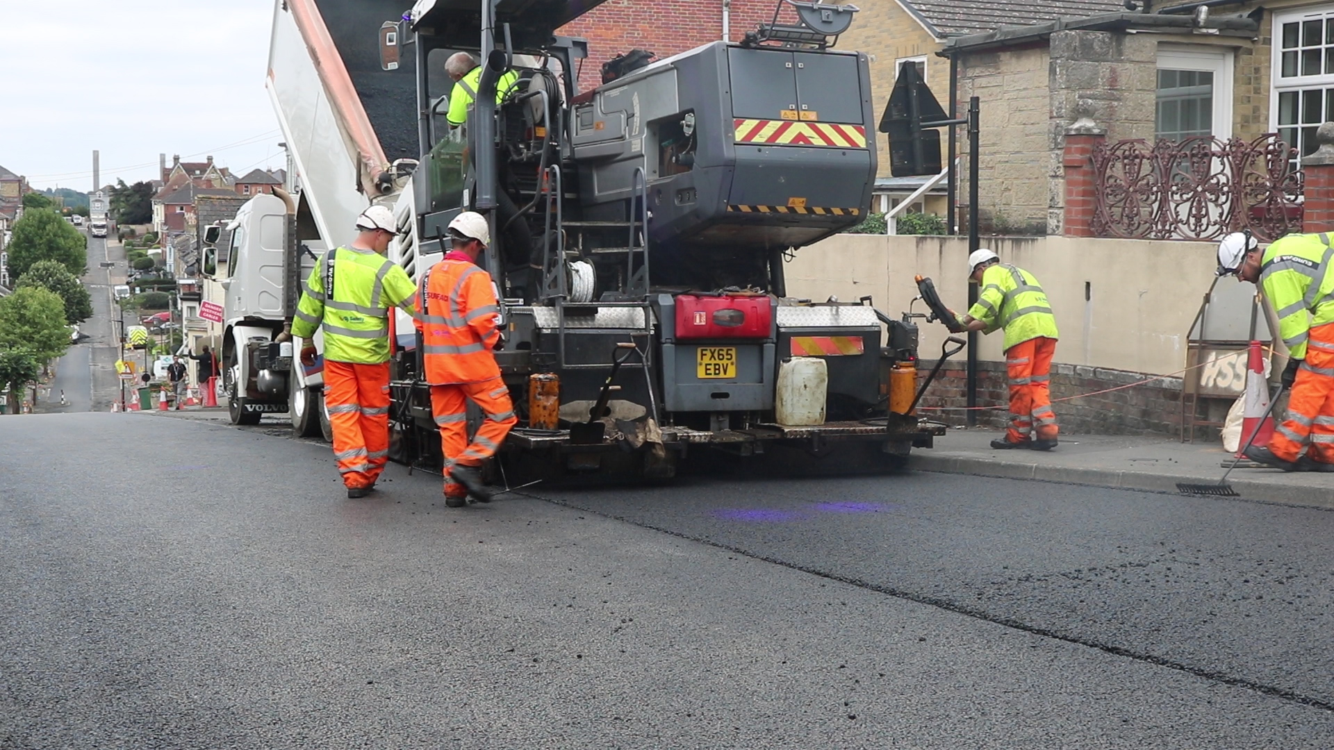 photo showing Island Roads crew members resurfacing Victoria Road in Cowes
