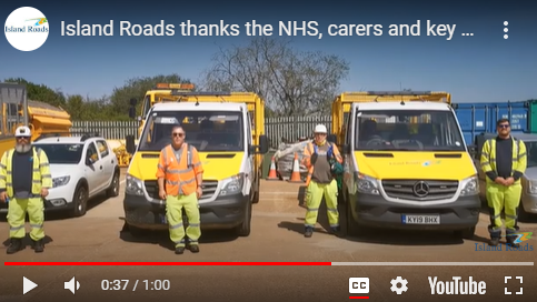 Still from a video taken to thank the NHS showing Island Roads workers in PPE in front of their vehicles