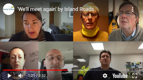 Still from a video showing Island Roads staff singing on screen