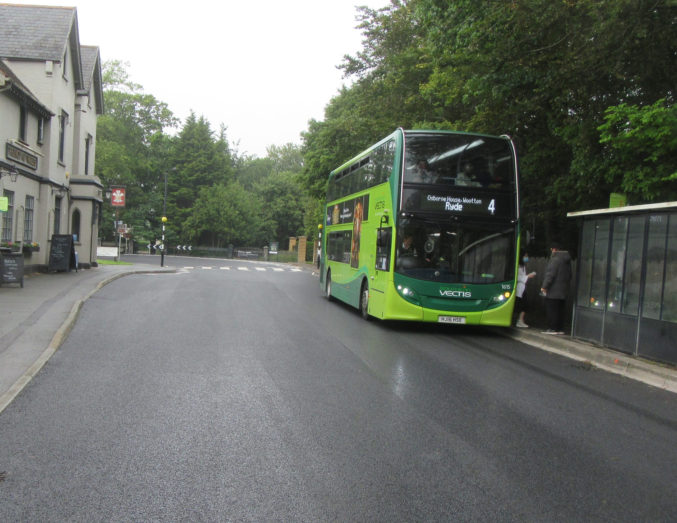 Photo showing the resurfaced road in York Avenue outside the garage on the approach to Osborne House in East Cowes. Bus on the right hand side at the bus stop.