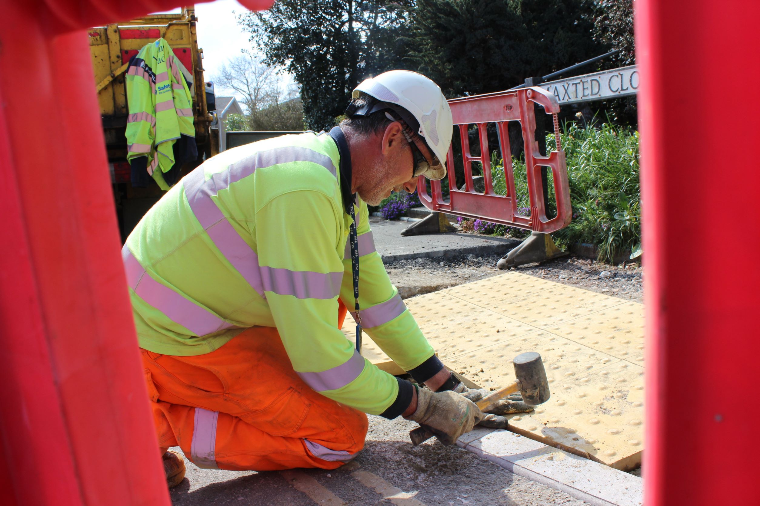 An Island Roads worker installing a dropped access kerb in Maxted Close, Cowes.